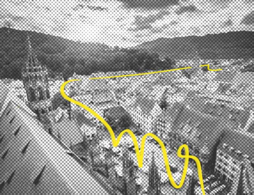 Ein Foto von Freiburg aus der Vogelperspektive. Eine gelbe Linie schlängelt sich durch die Stadt.